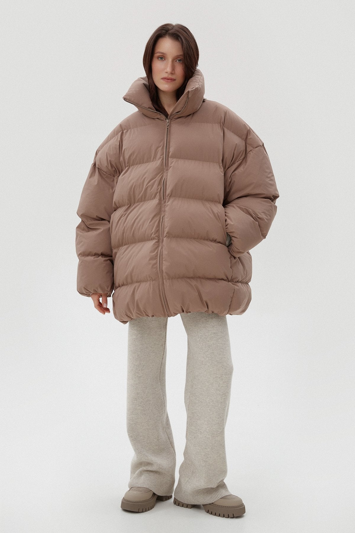 Women's light brown puffer jacket by Estro.