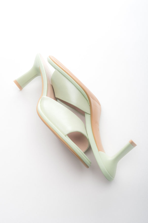 Heeled women’s light green leather mules Estro.