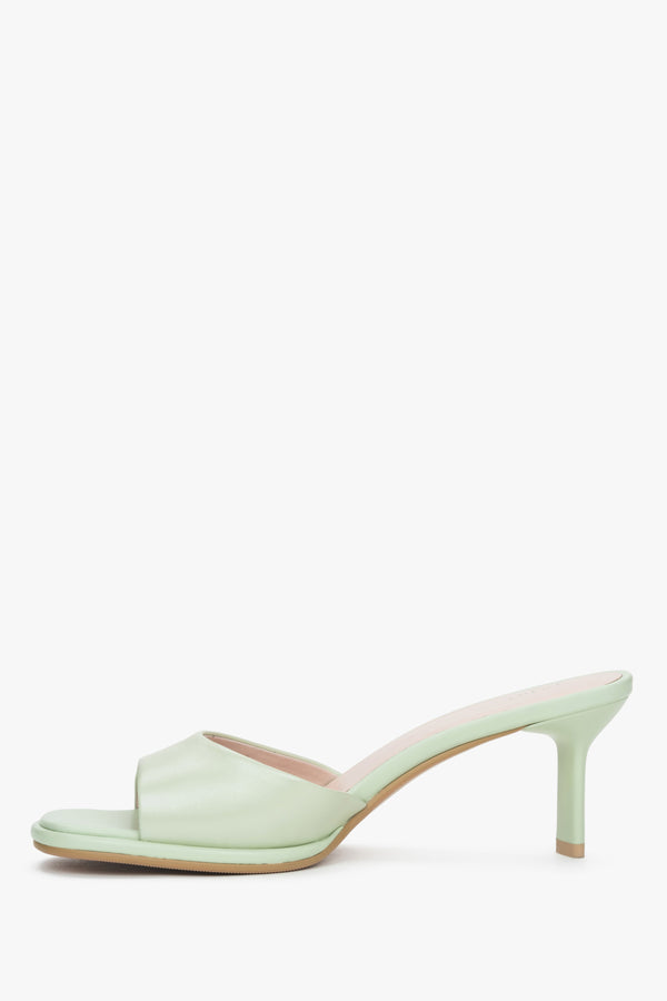 Light green heeled mules made of genuine leather.