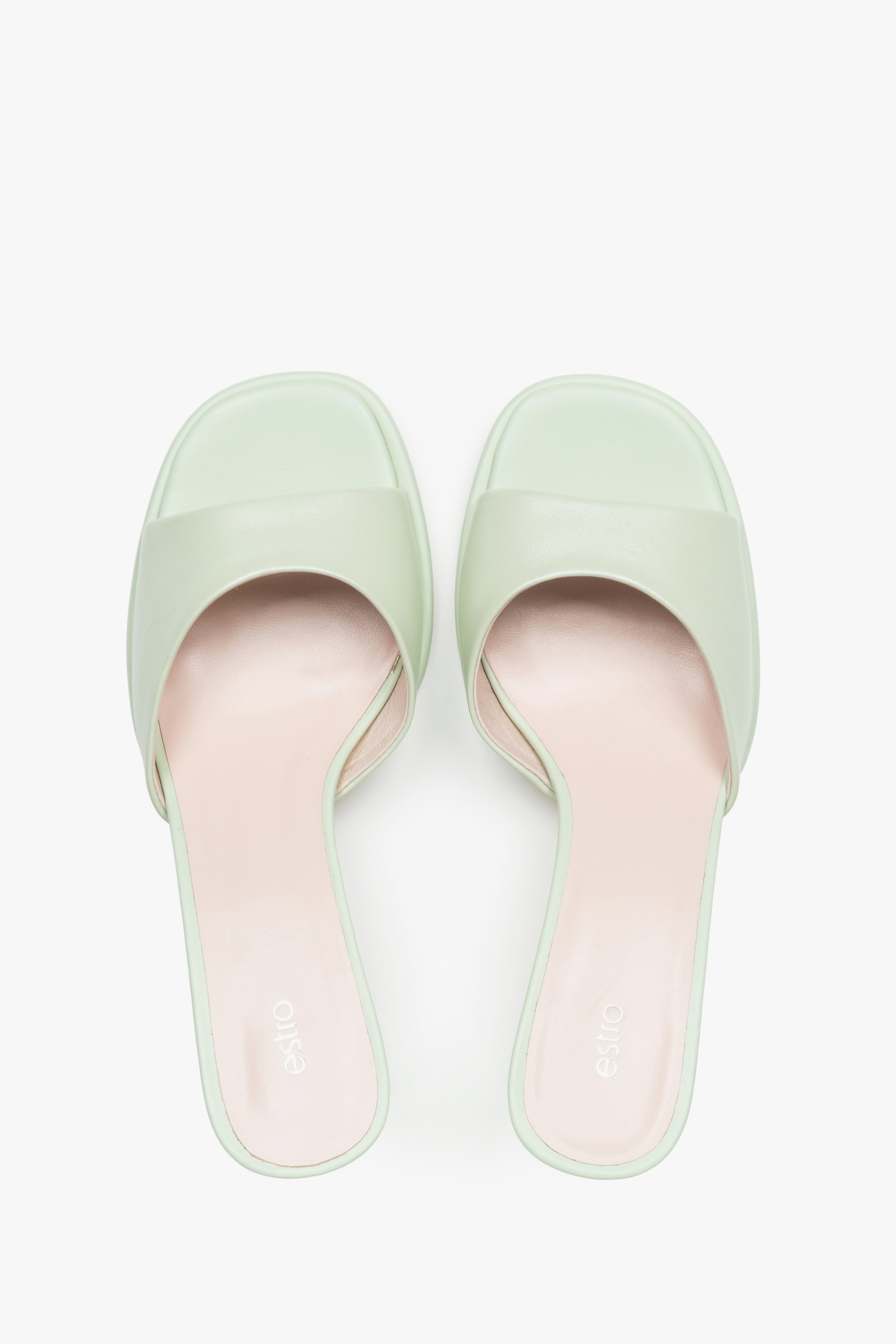 Made of genuine leather, light green women’s heeled mules Estro.