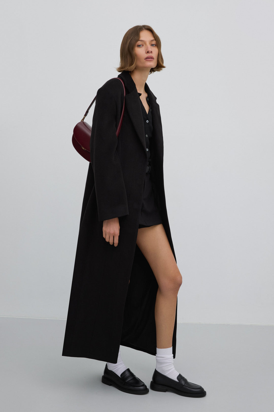 Women’s long black coat in a classic cut, tied at the waist, Estro ER00117927.