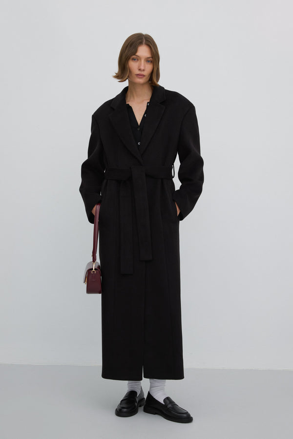 Long black women’s coat with a waist tie in a classic cut, Estro ER00117927.