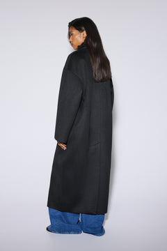 Made of camel wool and cashmere long black women’s coat tied at the waist Estro.