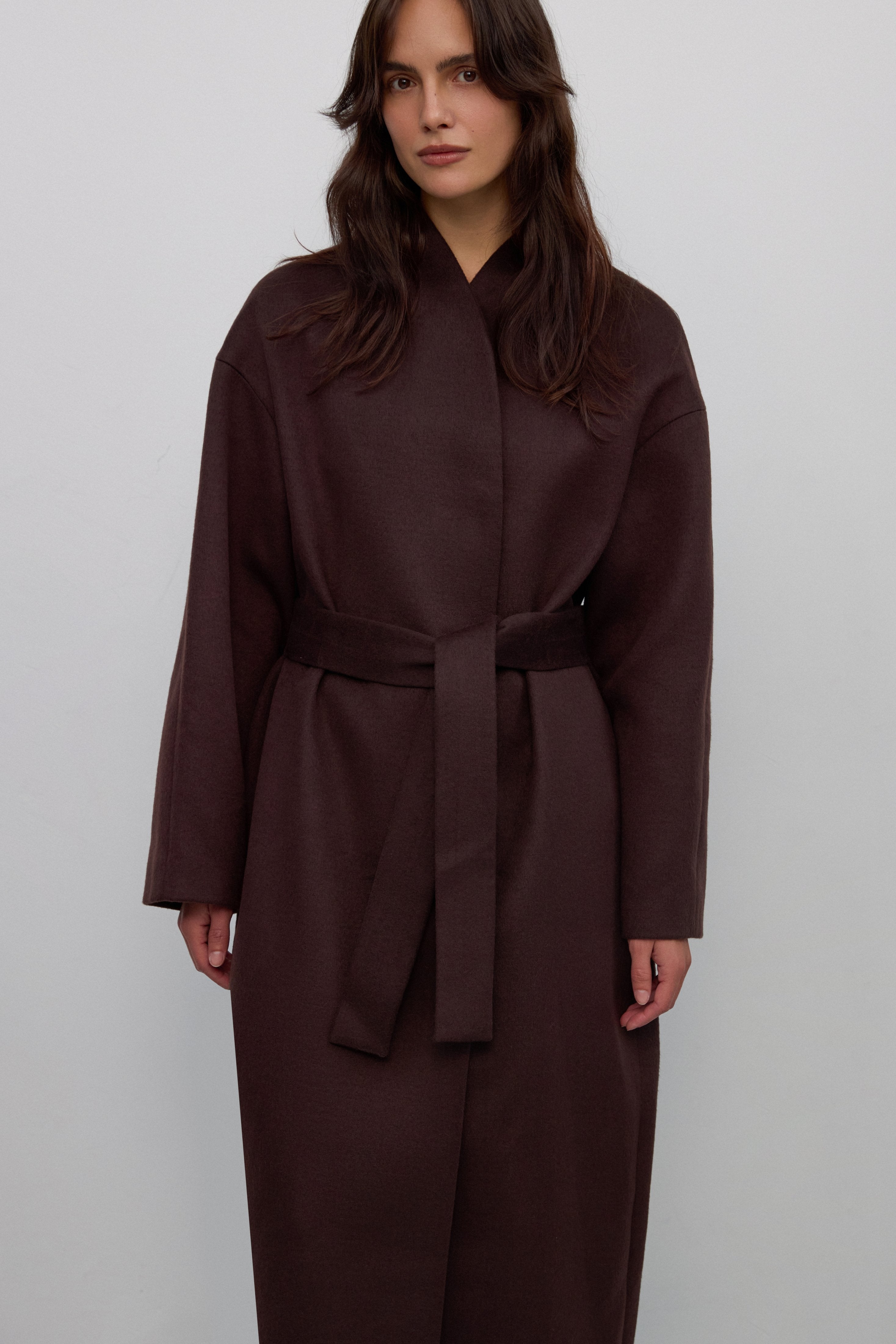 Made of camel wool and cashmere long dark brown women’s coat tied at the waist Estro ER00117932.