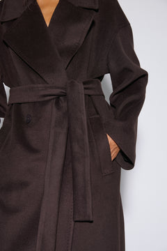 Women's dark brown wool coat Estro - close-up view highlighting the rich natural wool texture and lapel stitching.