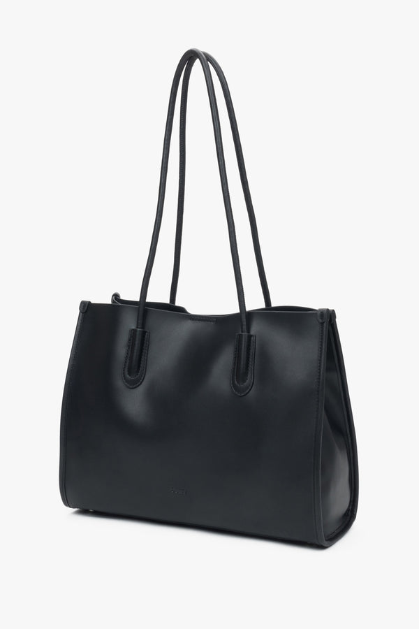 Black leather shopper bag by Estro with long handles, comfortable for everyday shoulder wear.