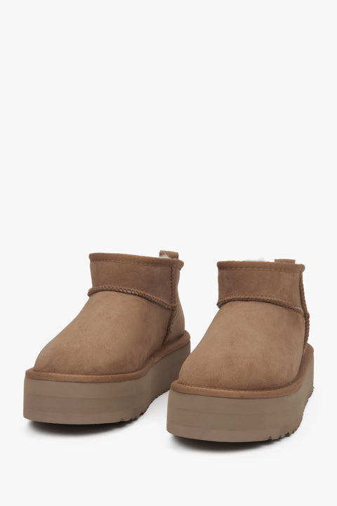 Low women's snow boots by Estro, made of beige genuine velour with a warm fur lining.