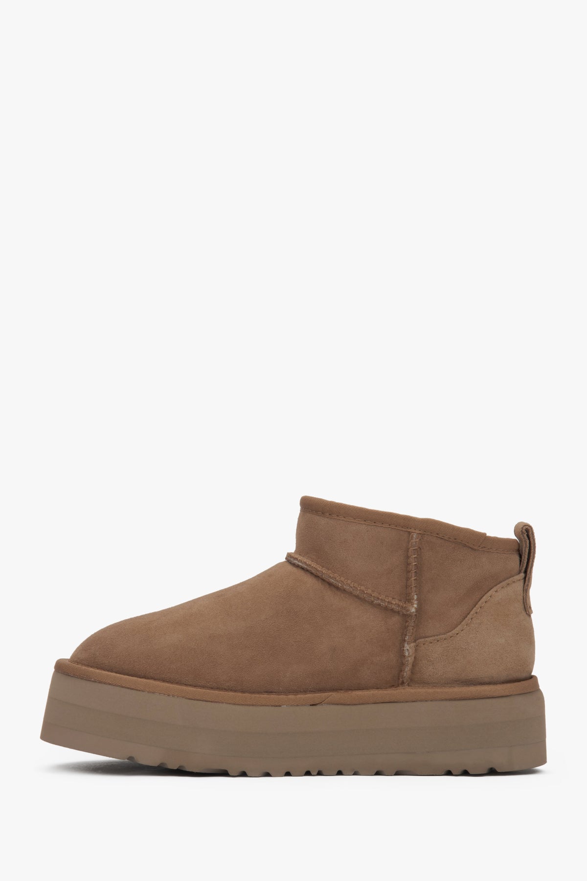 Beige low velour snow boots by Estro with fur.