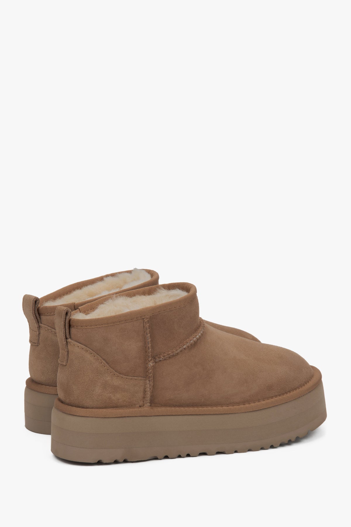 Beige low velour snow boots by Estro.
