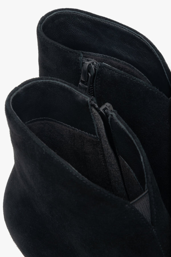 Low, black women’s ankle boots made of genuine velour with a funnel heel.