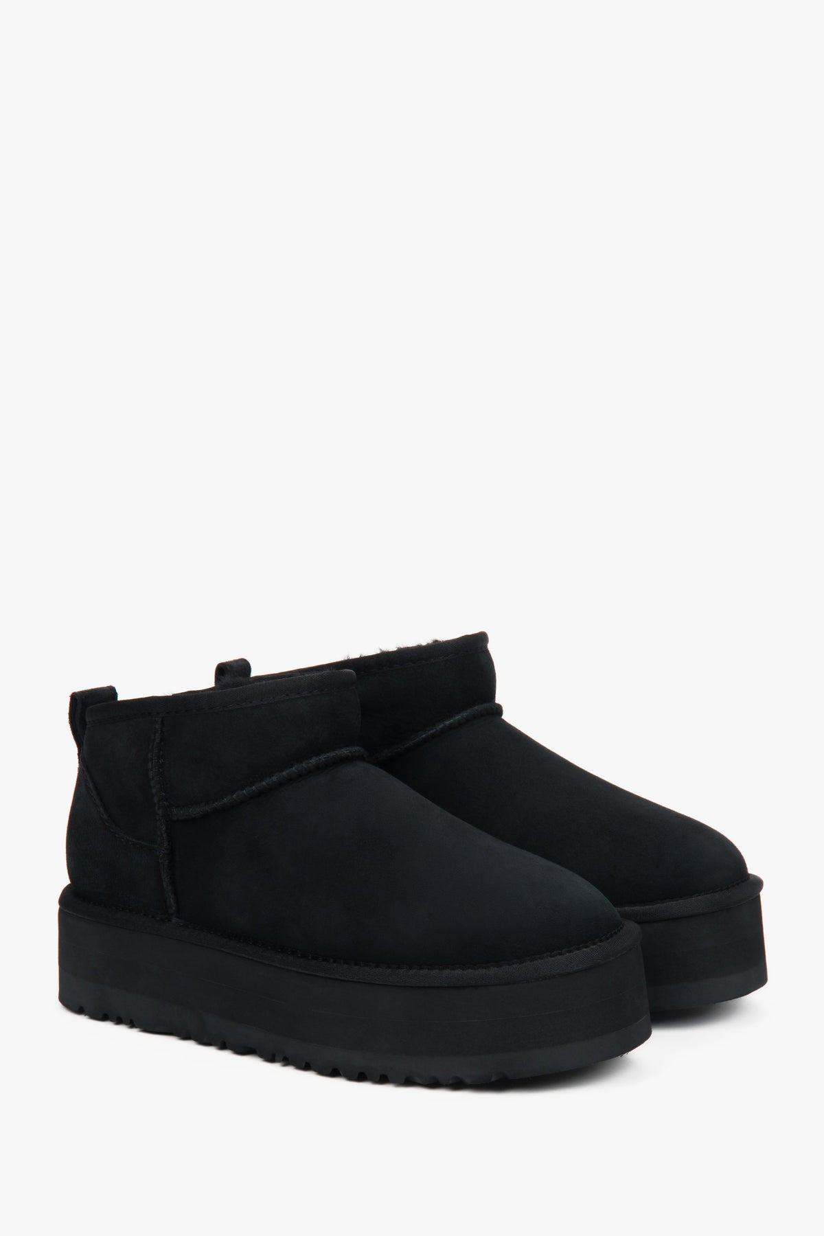Low black women's snow boots made of genuine velour with fur.