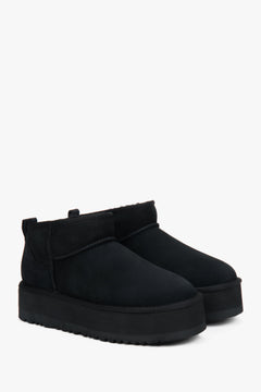 Low black women's snow boots made of genuine velour with fur.