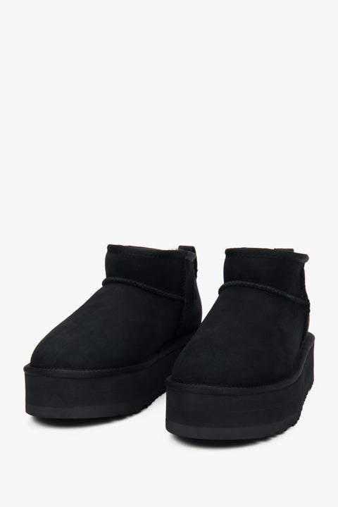 Low women's snow boots by Estro, made of black genuine velour with a warm fur lining.