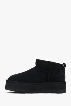 Black low velour snow boots by Estro with fur.