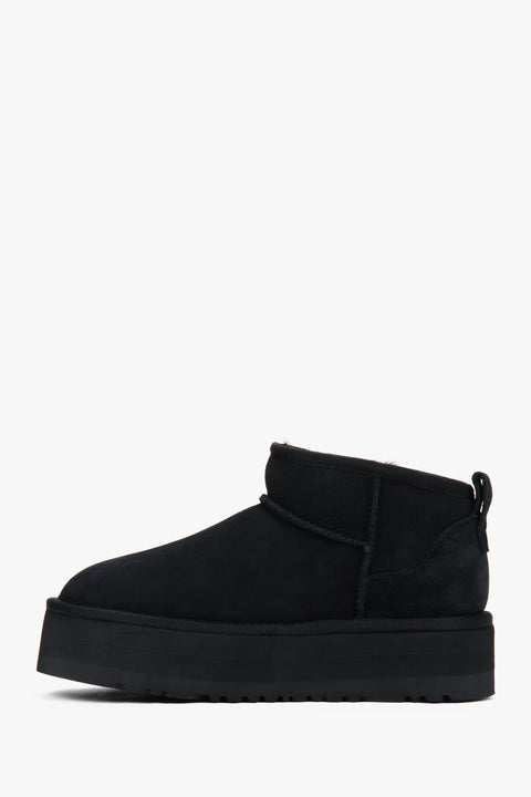 Black low velour snow boots by Estro with fur.