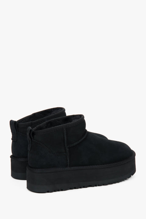 Black low velour snow boots by Estro.