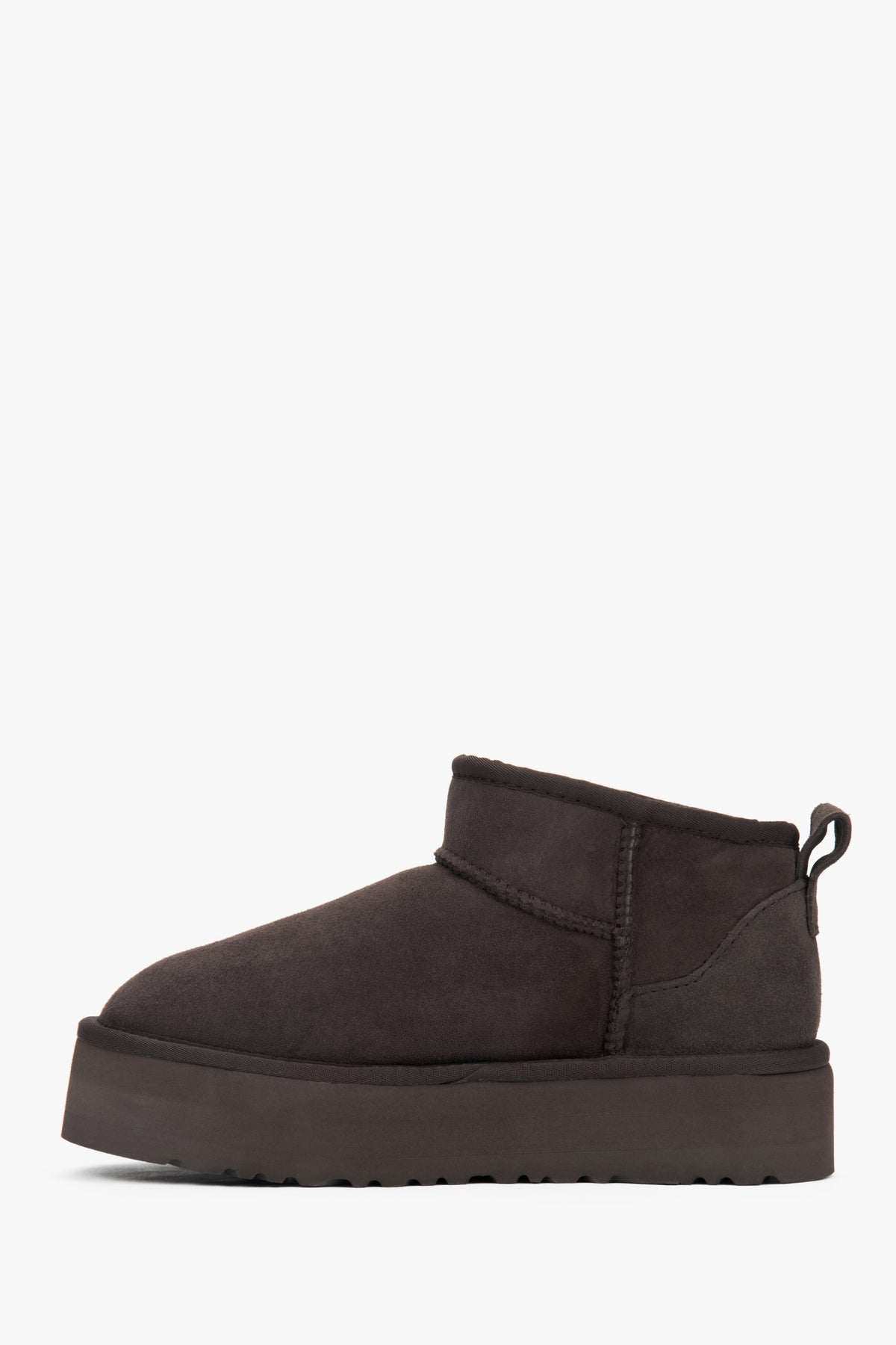Brown low velour snow boots by Estro with fur.
