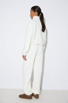 Women's milk white fleece tracksuit set Estro - back view highlighting the comfortable cut and hooded detail.