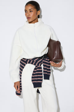Milk white fleece lounge set featuring hoodie and matching sweatpants, Estro.