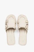 Women’s Milky Beige Leather Flat Slide Sandals with Gold Buckles Estro ER00119557.