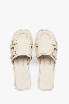Women’s Milky Beige Leather Flat Slide Sandals with Gold Buckles Estro ER00119557.