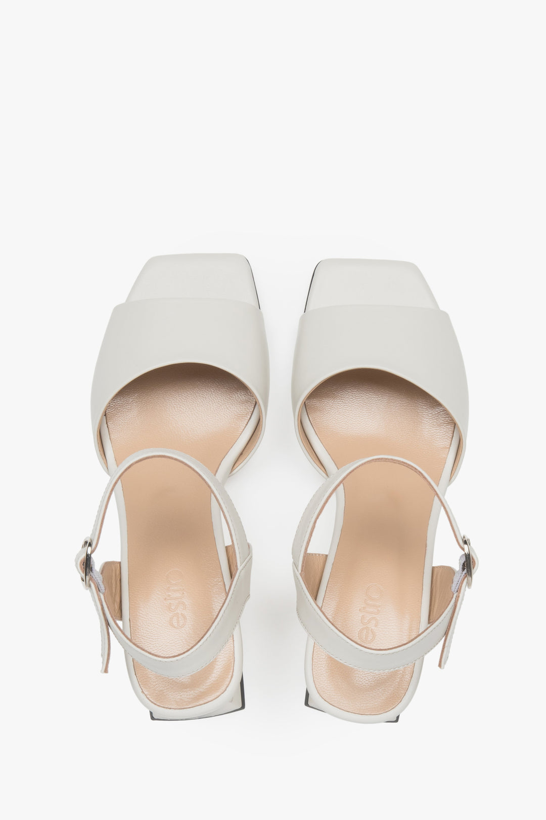 Women’s milk-beige Estro leather block-heel sandals with an adjustable buckle.