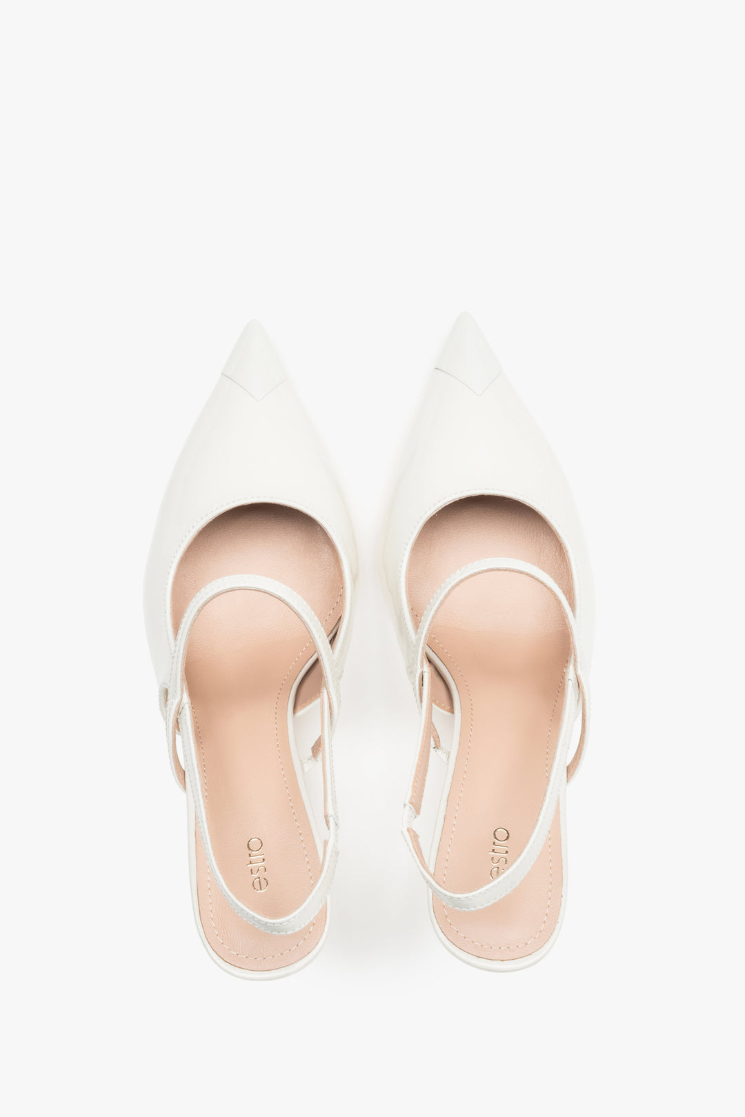 Close-up of the high-gloss milky beige patent leather and elegant strap detail.