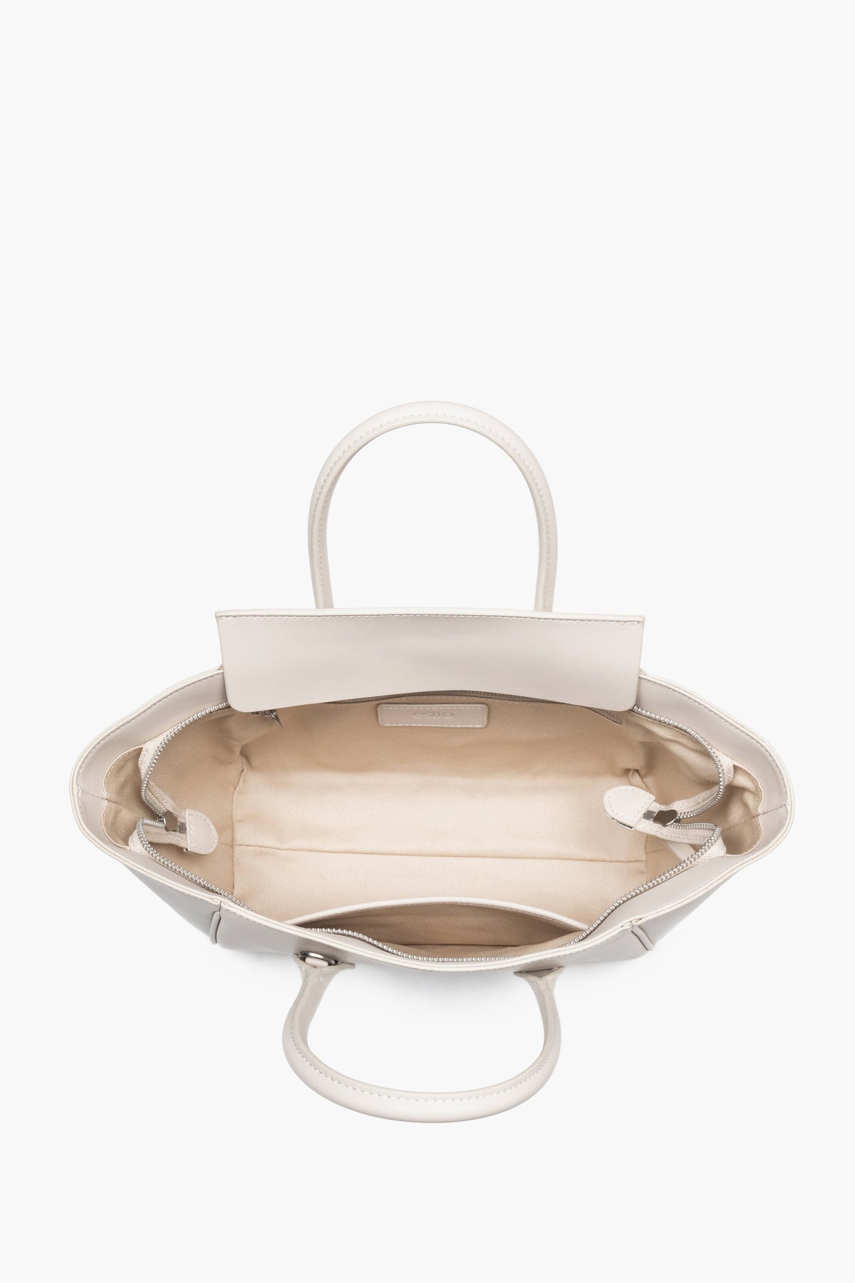 Top view of the open zippered compartment, showing wide, easy access to the lining and two internal pockets.