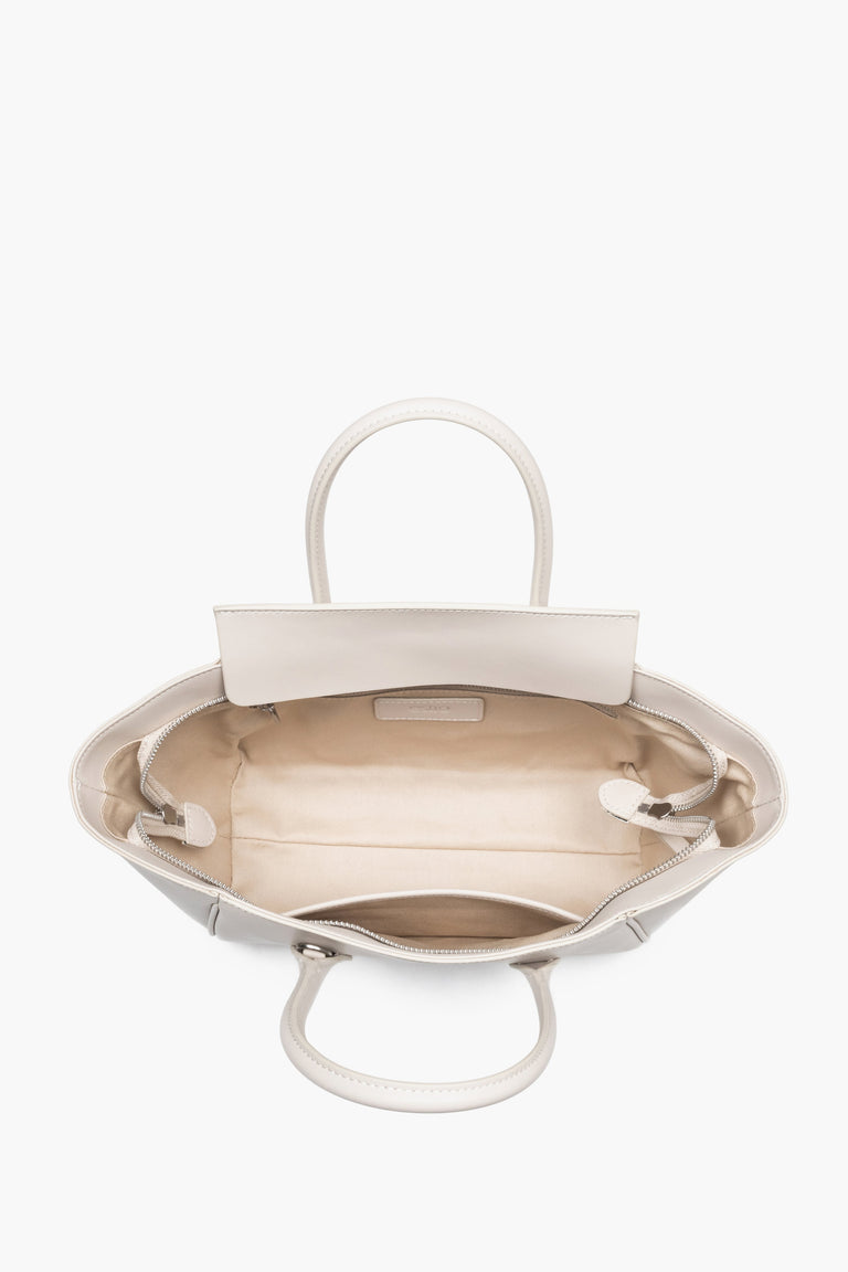 Top view of the open zippered compartment, showing wide, easy access to the lining and two internal pockets.