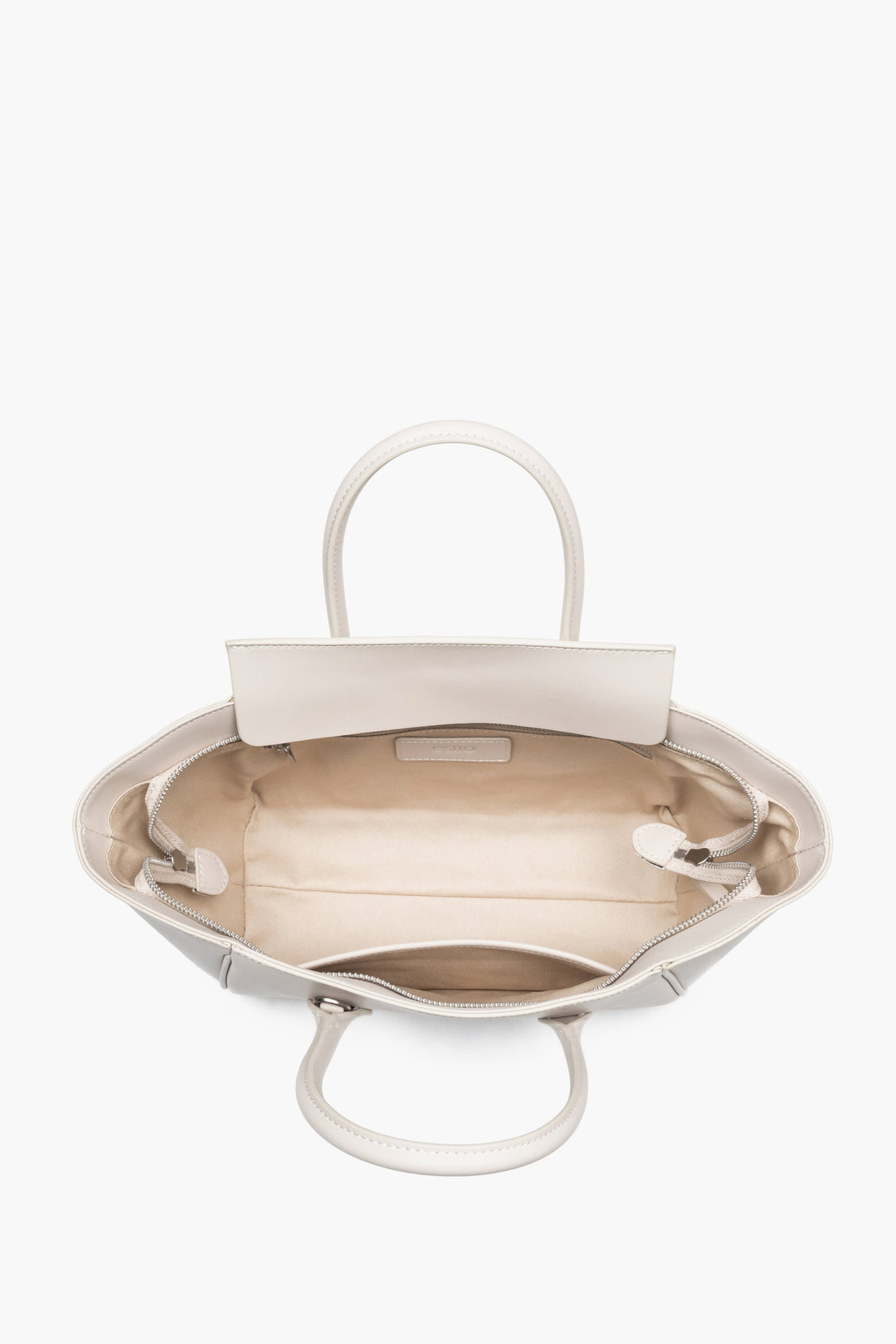 Top view of the open zippered compartment, showing wide, easy access to the lining and two internal pockets.
