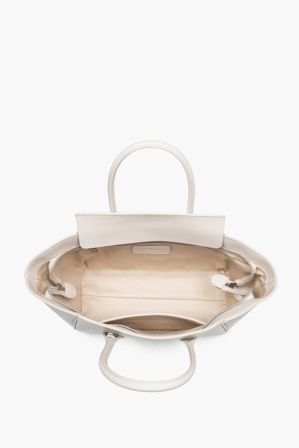 Top view of the open zippered compartment, showing wide, easy access to the lining and two internal pockets.