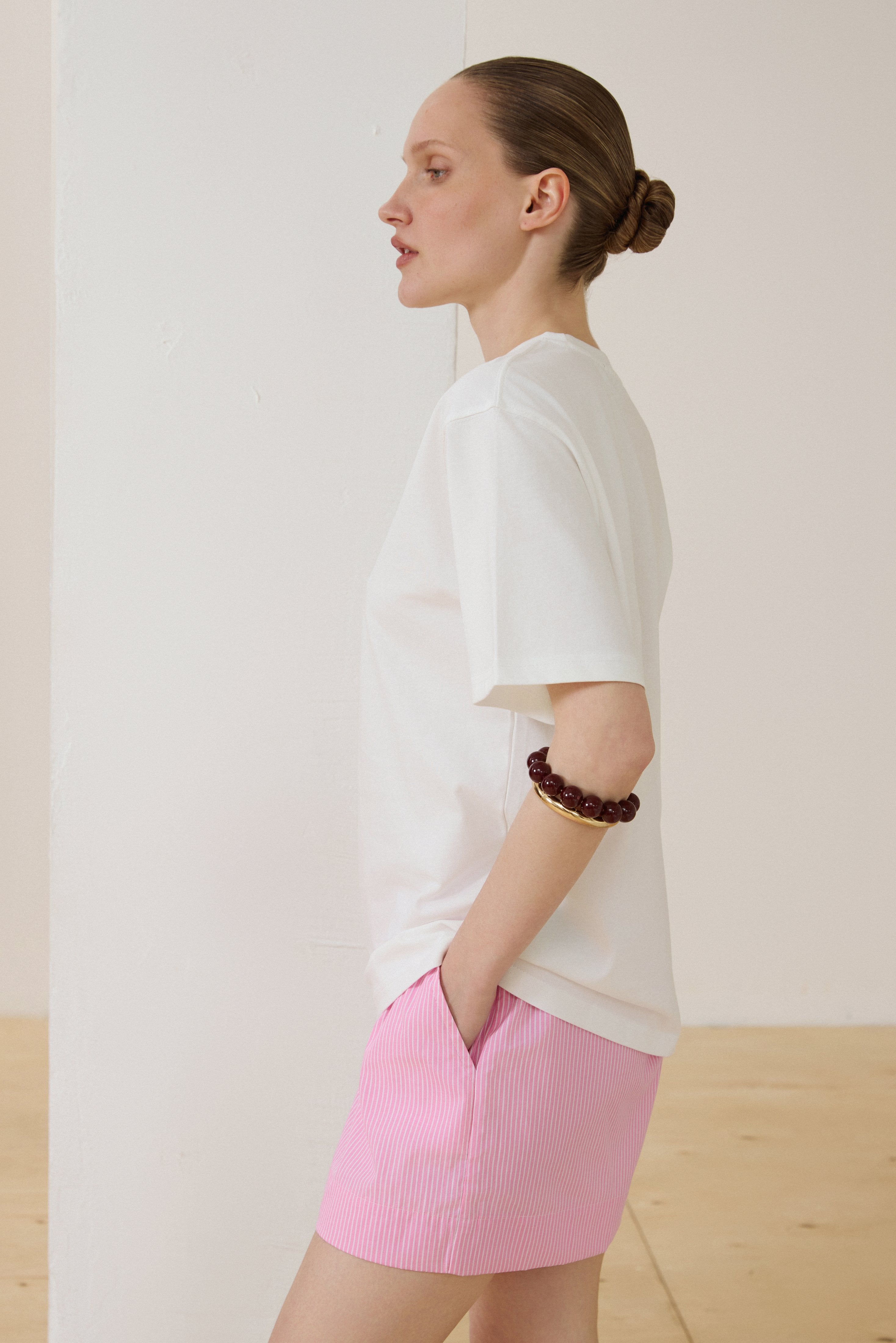 Milky white boxy cotton T-shirt with dropped shoulders.