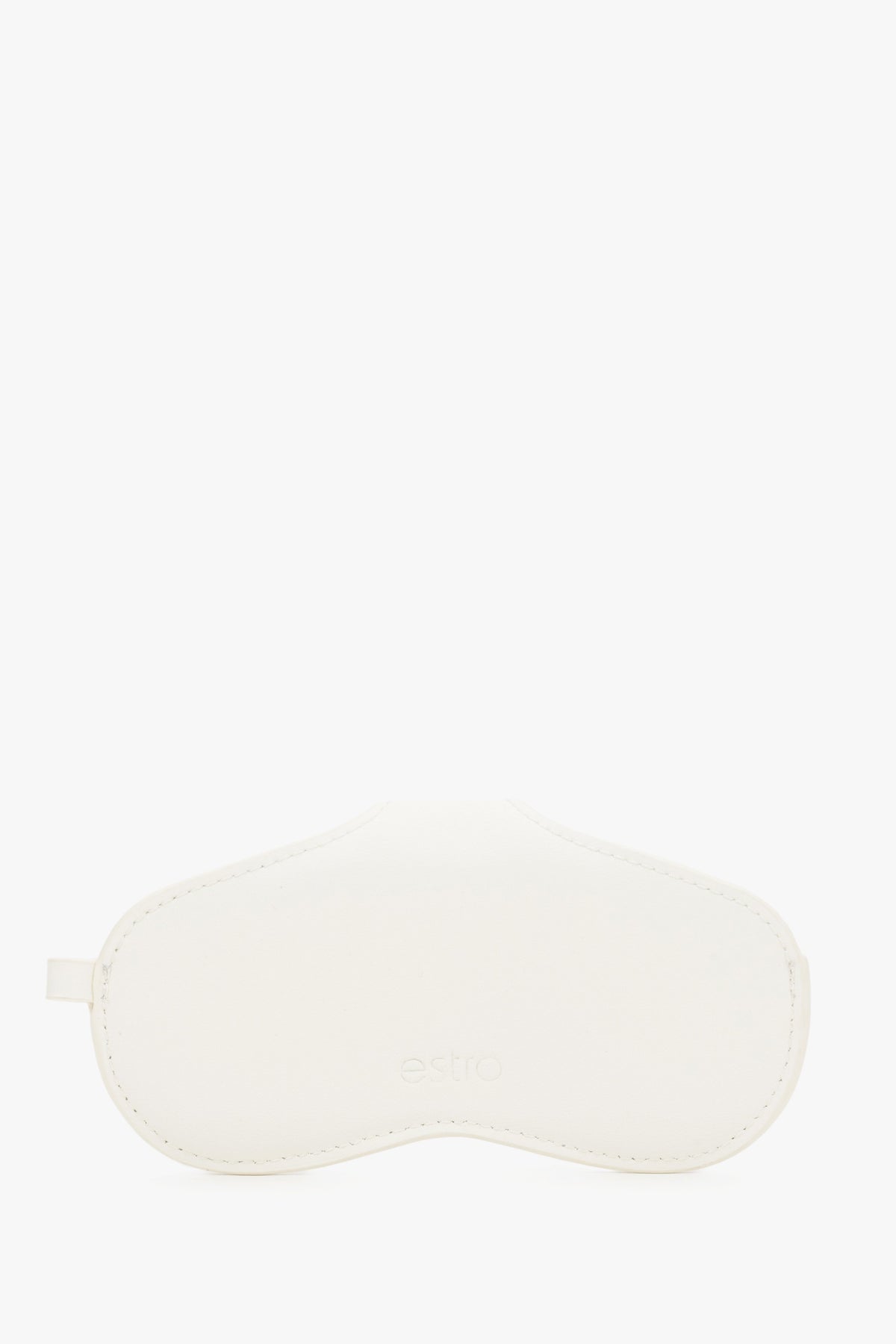 A side view emphasizing the slim, compact profile of the white case and its precise, tonal stitching.