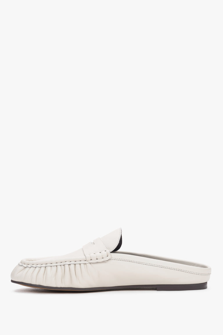 Elegant women’s slip-on mules showcasing a low, stable heel and a perfectly contoured arch line.