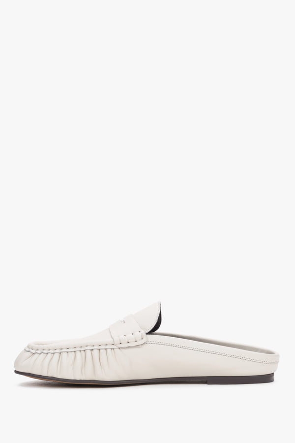Elegant women’s slip-on mules showcasing a low, stable heel and a perfectly contoured arch line.