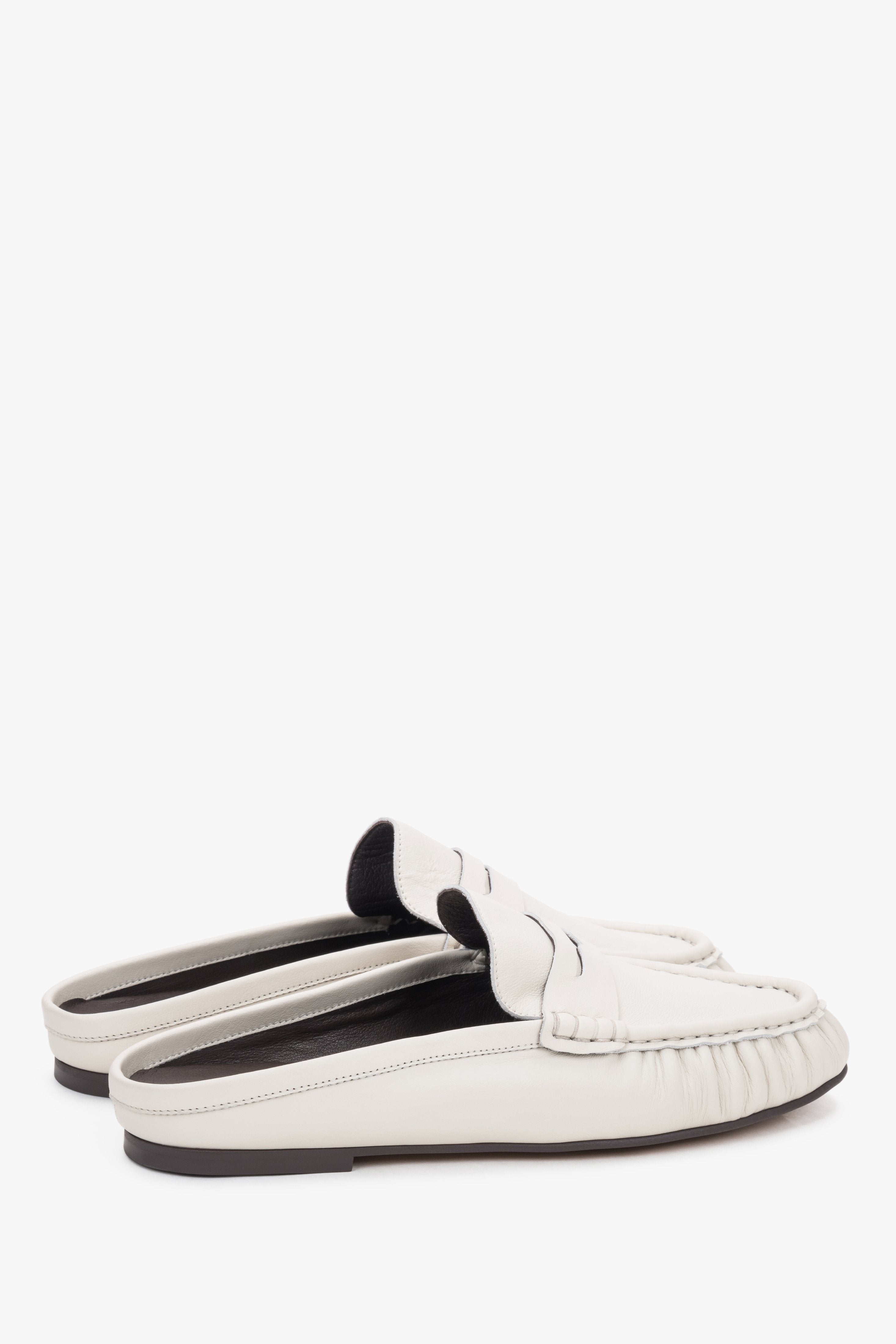 Sole view of the shoe showing an elegant, smooth outsole made of abrasion-resistant thunit with subtle branded embossing.