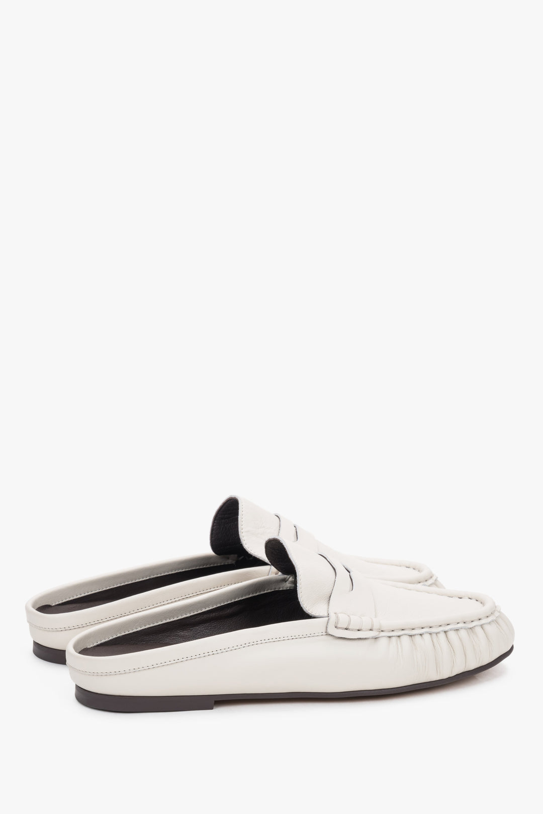 Sole view of the shoe showing an elegant, smooth outsole made of abrasion-resistant thunit with subtle branded embossing.