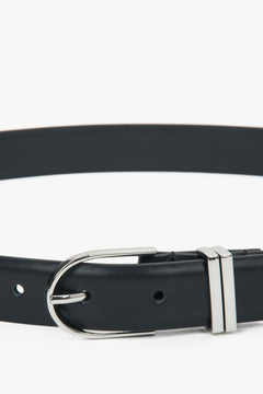 Minimalist black women’s belt made of genuine leather with silver-tone hardware.