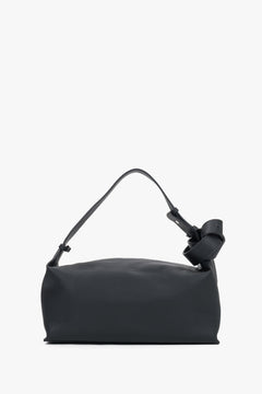 Women's minimalist black genuine leather shoulder bag with decorative knot strap Estro.