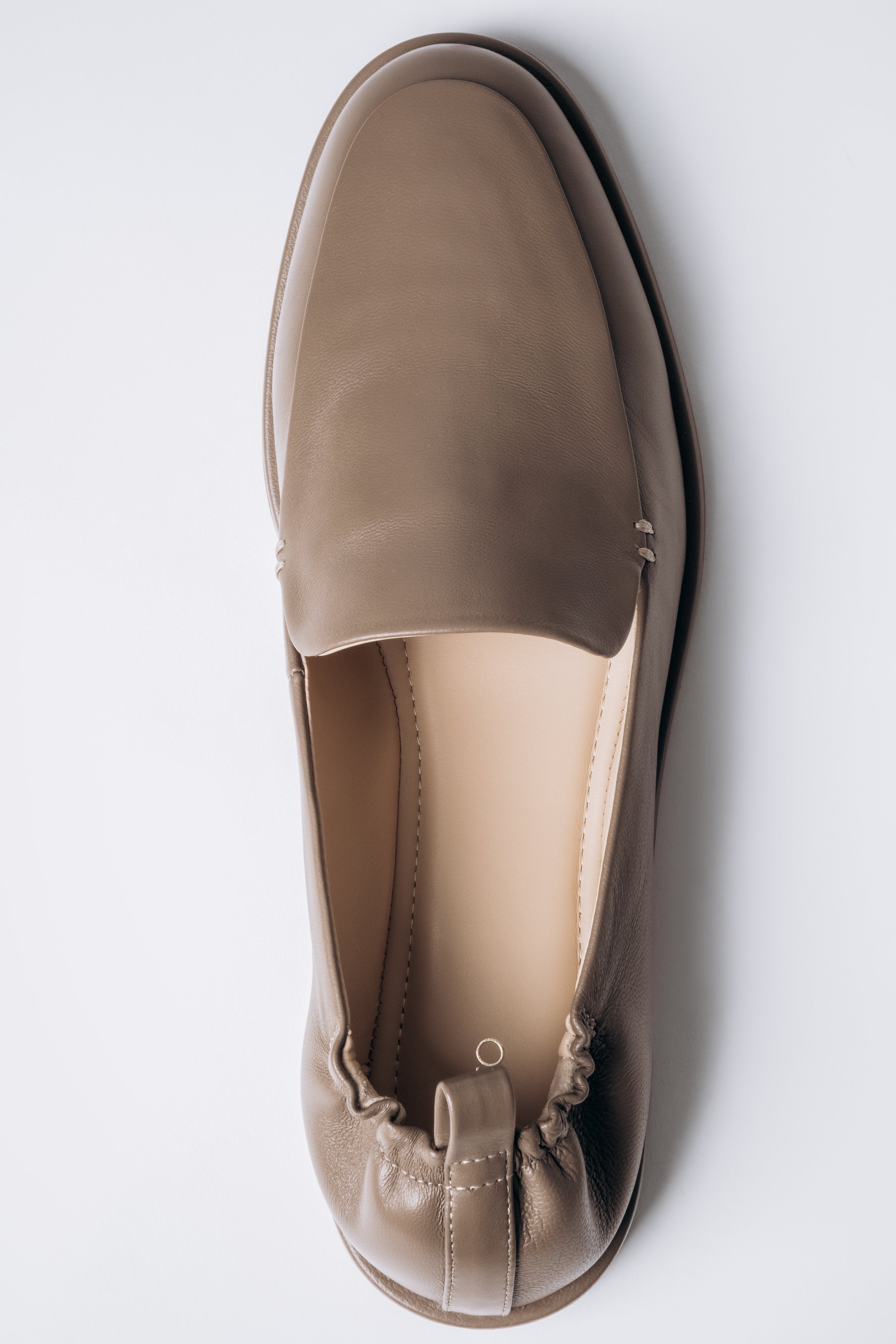Top view of women's olive green leather loafers by Estro