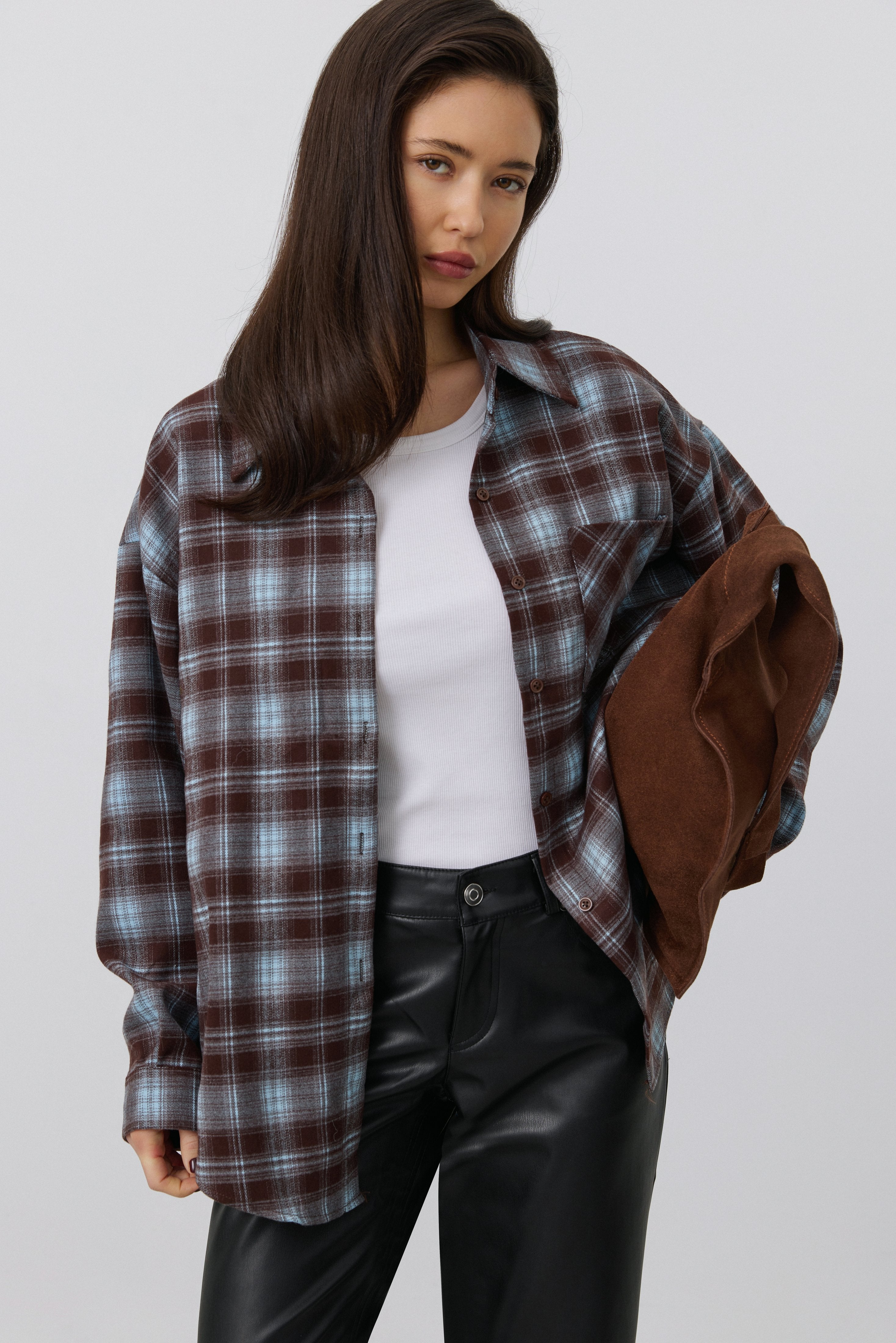 Women's oversized button-up shirt in burgundy and blue plaid.