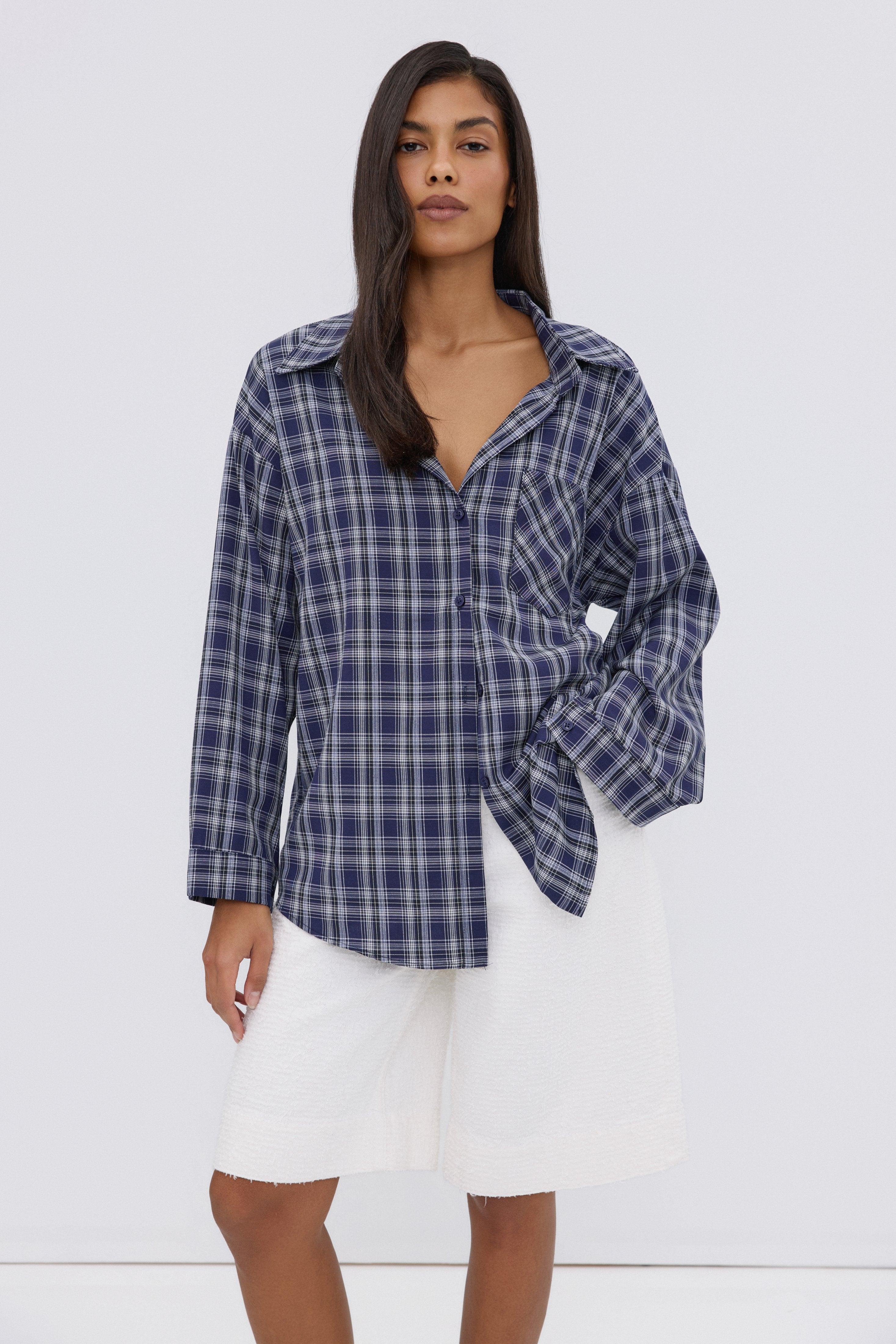 Navy women's Estro shirt, featuring an oversized fit, checkered pattern, and button-up closure.