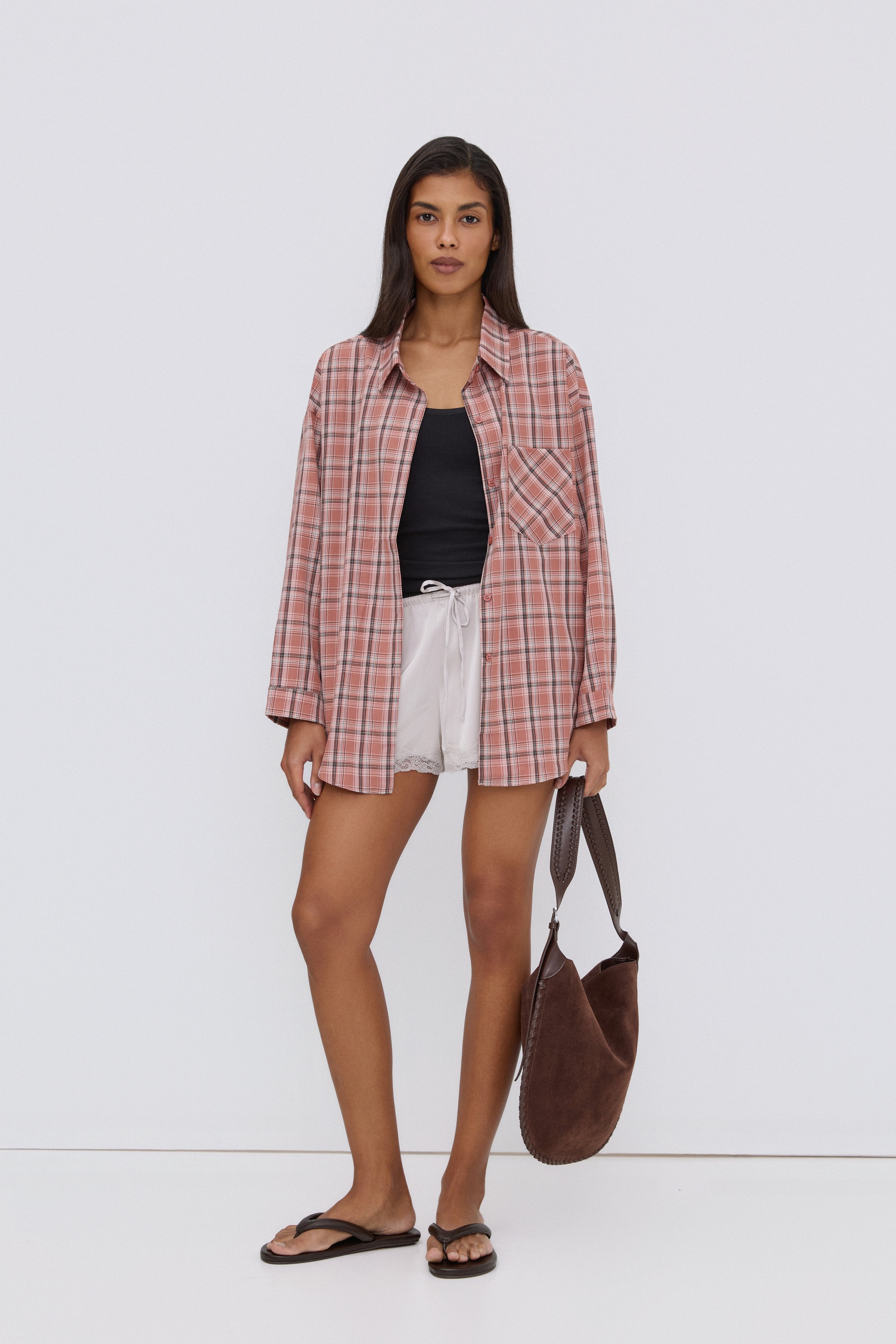 Pink women's Estro shirt, featuring an oversized fit, checkered pattern, and button-up closure.