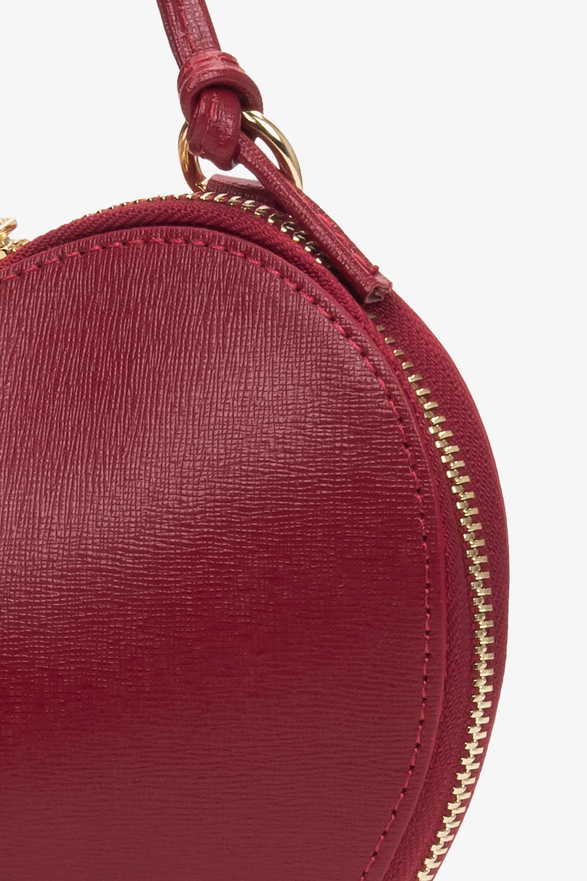 Red leather heart-shaped bag for women.