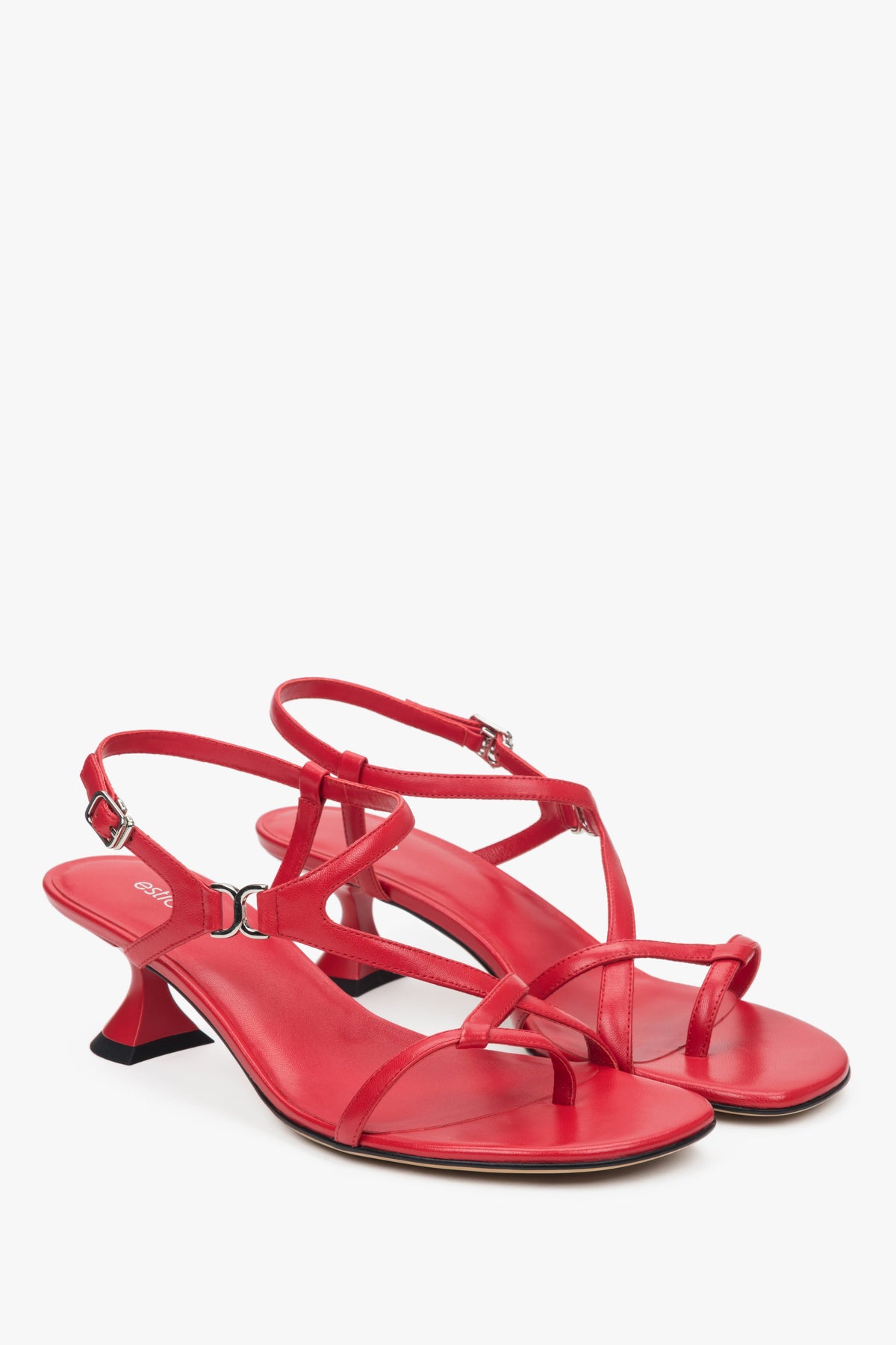 Red women’s sandals with a funnel heel and woven straps.