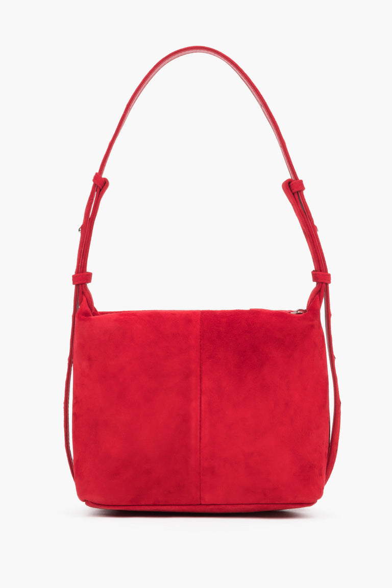 The smooth back of the bag is made of natural velvet with elegant vertical stitching down the center.