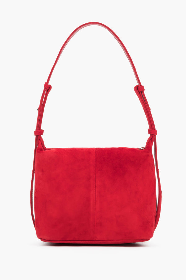 The smooth back of the bag is made of natural velvet with elegant vertical stitching down the center.