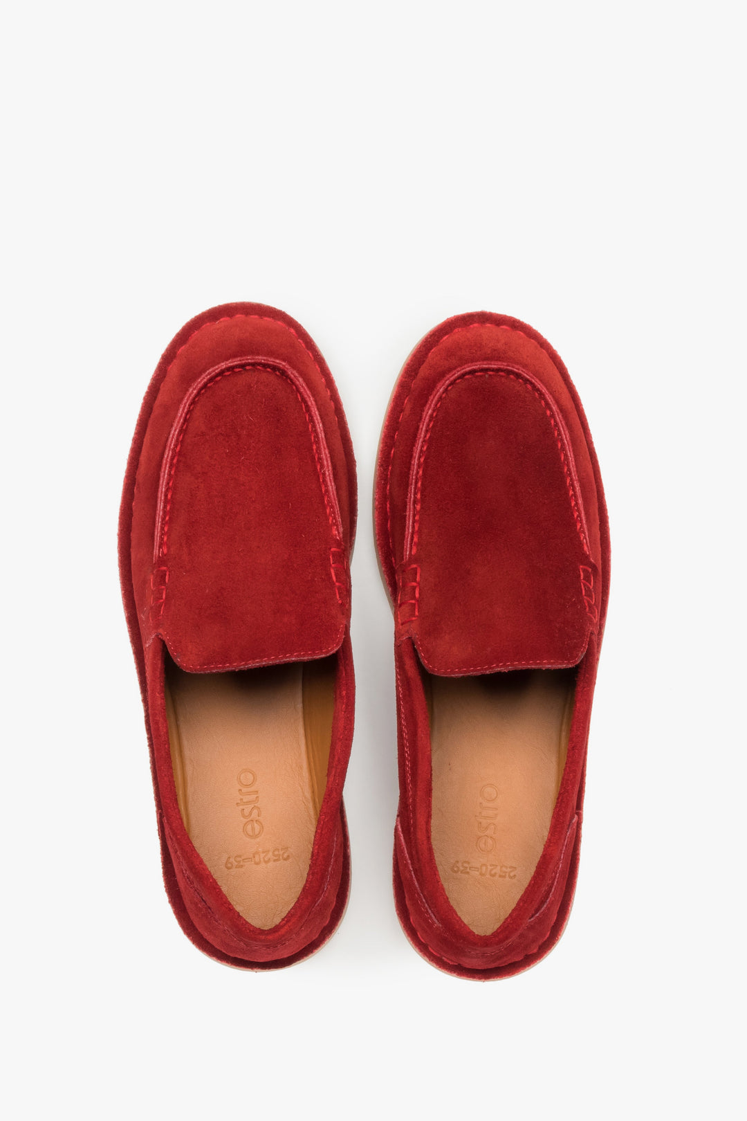 Top view of a pair of shoes showcasing a rounded toe with a distinctive raised seam and a light leather insole featuring the brand logo.