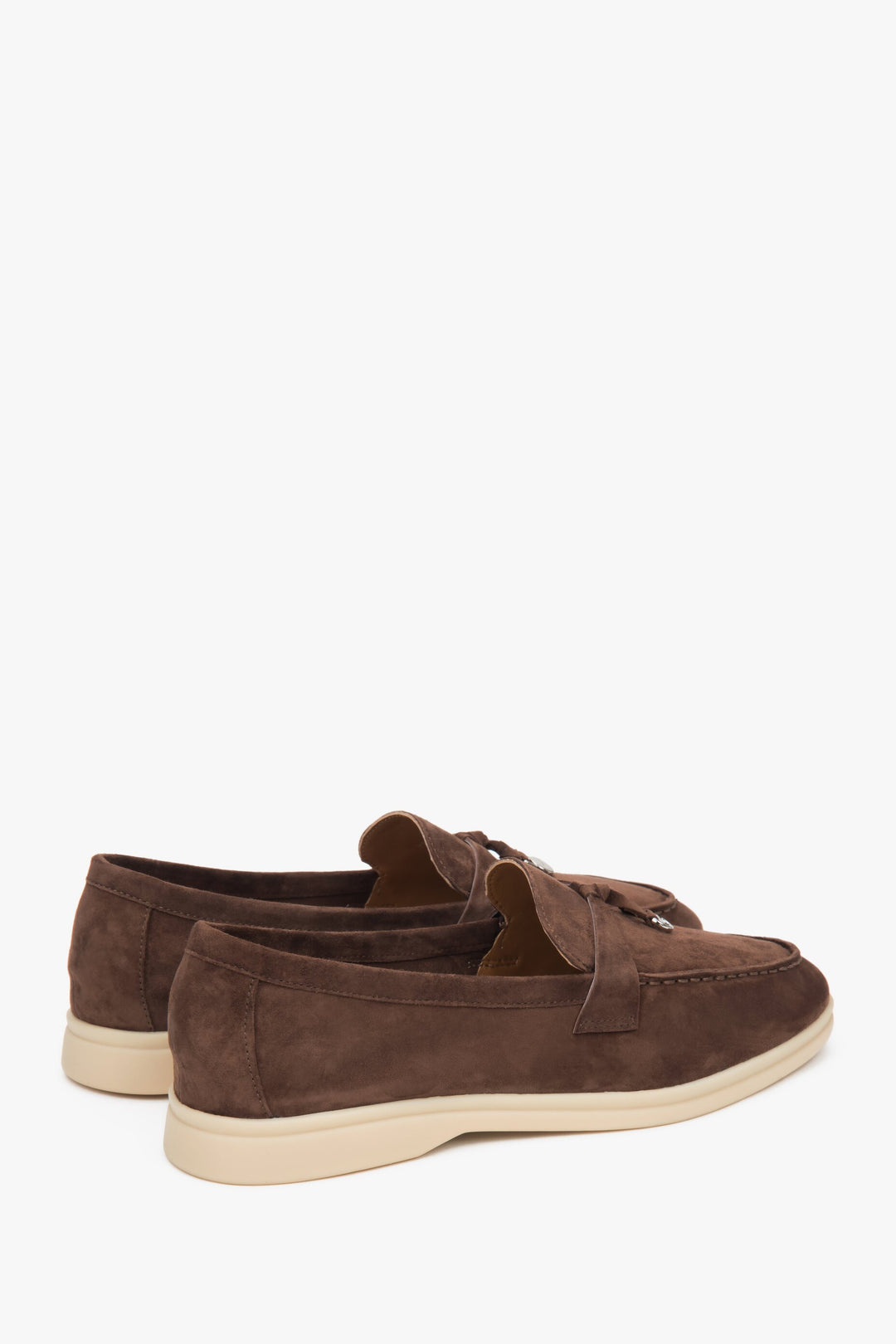 Saddle brown women's loafers made of natural velour and leather - close up on heel counter.