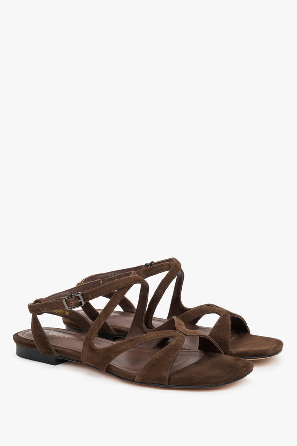 Saddle brown strappy sandals with flat sole.